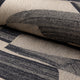 Champagne and black abstract jacquard upholstery fabric by the yard, rolled bolt view