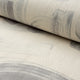 Gray and cream abstract printed linen fabric by the yard, rolled bolt view