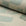 Sage green and cream abstract printed linen fabric by the yard, rolled bolt view