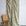 Sage green and cream abstract printed linen fabric by the yard, draped to show pattern and scale