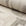 Beige and cream abstract printed linen fabric by the yard, rolled bolt view
