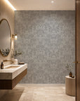 Black and white feather print wallpaper installed in a powder room