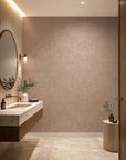 Soft taupe feather print wallpaper installed in a powder room
