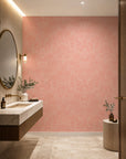 Pink feather print commercial wallcovering installed in a powder room