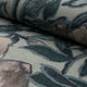Dusky blue and coral floral printed linen fabric by the yard, rolled bolt view