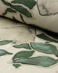 Cream and green floral printed linen fabric by the yard, rolled bolt view