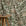 Cream and green floral printed linen fabric by the yard, draped to show pattern and scale