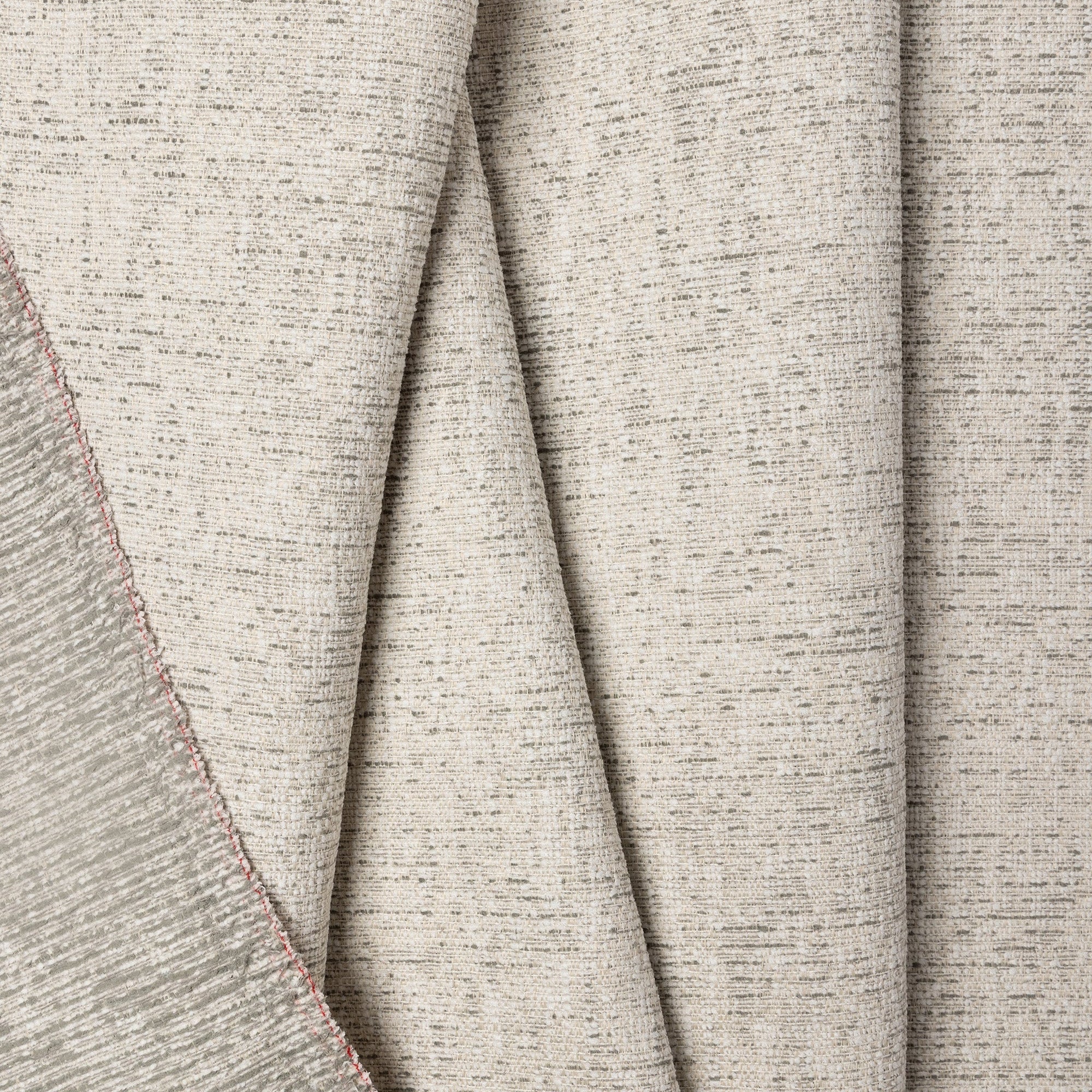 Gray marled chenille outdoor fabric by the yard, folded showing drape and weight