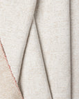 Cream marled chenille outdoor fabric by the yard, folded showing drape and weight
