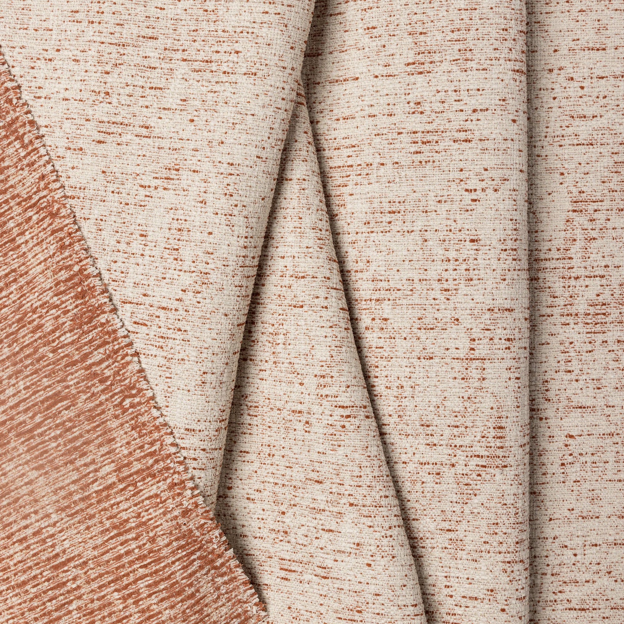 Terracotta marled chenille outdoor fabric by the yard, folded showing drape and weight