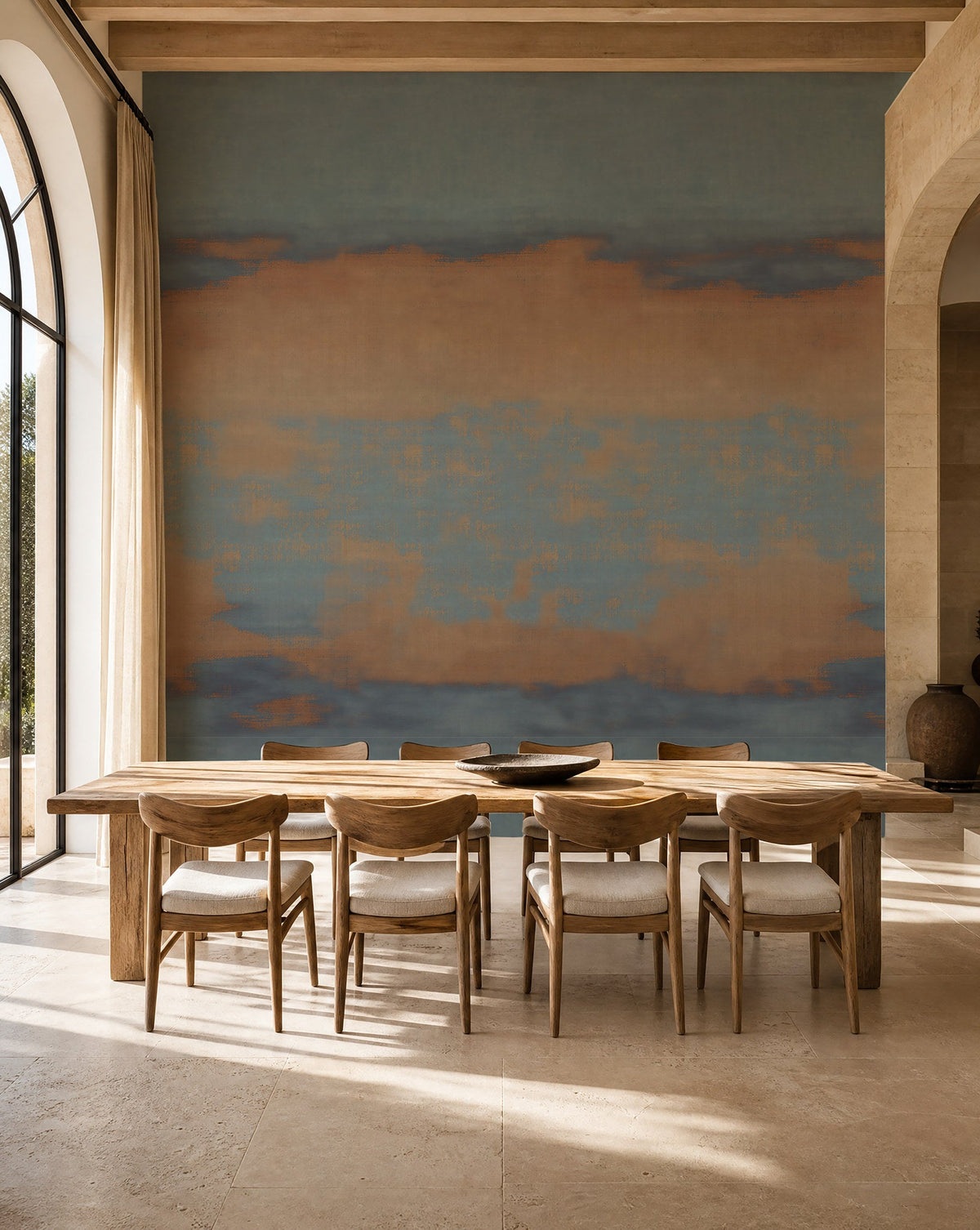 Blue and copper sunset ombre mural wallpaper installed in a sunlit dining room
