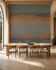 Blue and copper sunset ombre mural commercial wallcovering installed in a sunlit dining room