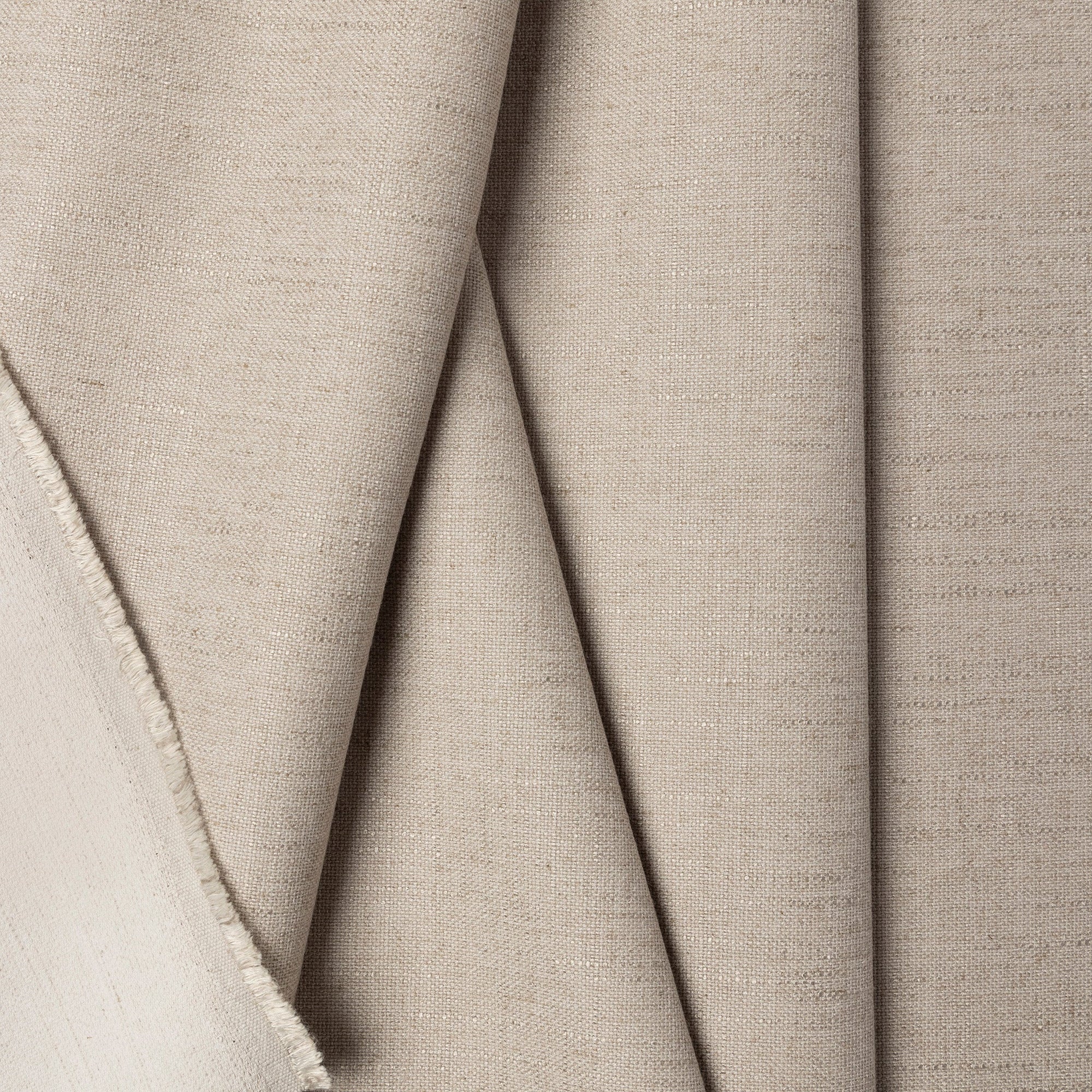 Gray linen upholstery fabric by the yard, folded showing drape and weight
