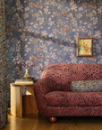Blue floral commercial wallcovering hung on the wall in a sitting room with floral walls