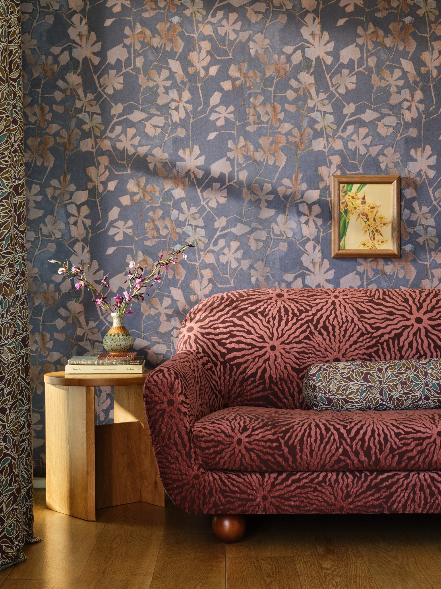 Blue floral cotton wallpaper hung on the wall in a sitting room with floral walls