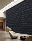 Navy stippled petal geometric wallpaper installed in a skylit lounge