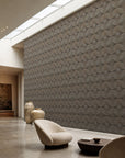 Taupe stippled petal geometric commercial wallcovering installed in a skylit lounge