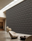 Slate gray stippled petal geometric commercial wallcovering installed in a skylit lounge