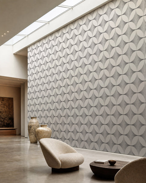 White and black stippled petal geometric wallpaper installed in a skylit lounge