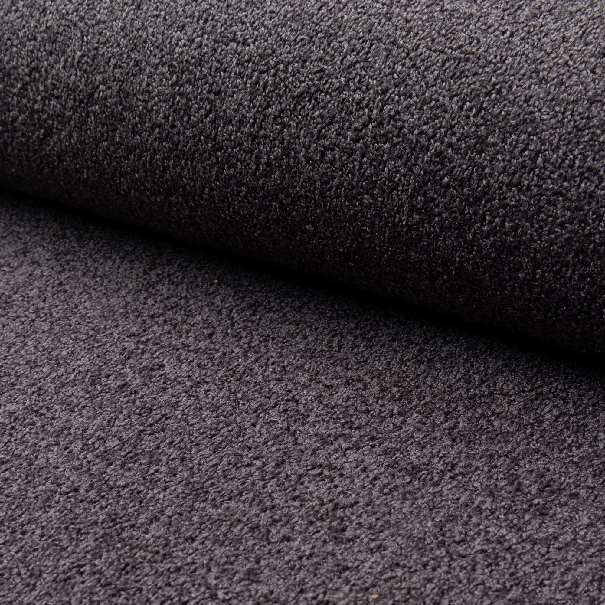 Black boucle upholstery fabric by the yard, rolled bolt view