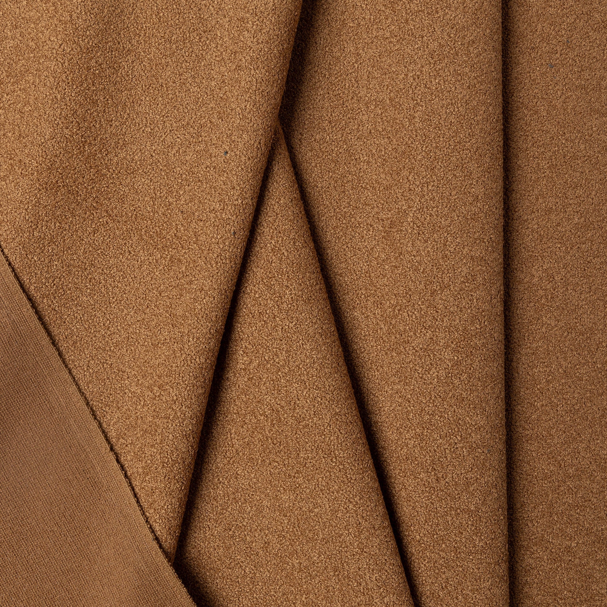 Brown boucle upholstery fabric by the yard, folded showing drape and weight