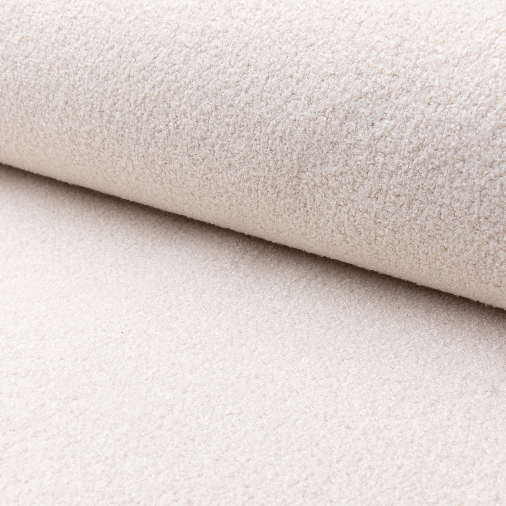 White boucle upholstery fabric by the yard, rolled bolt view