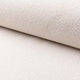 White boucle upholstery fabric by the yard, rolled bolt view