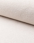 White boucle upholstery fabric by the yard, rolled bolt view