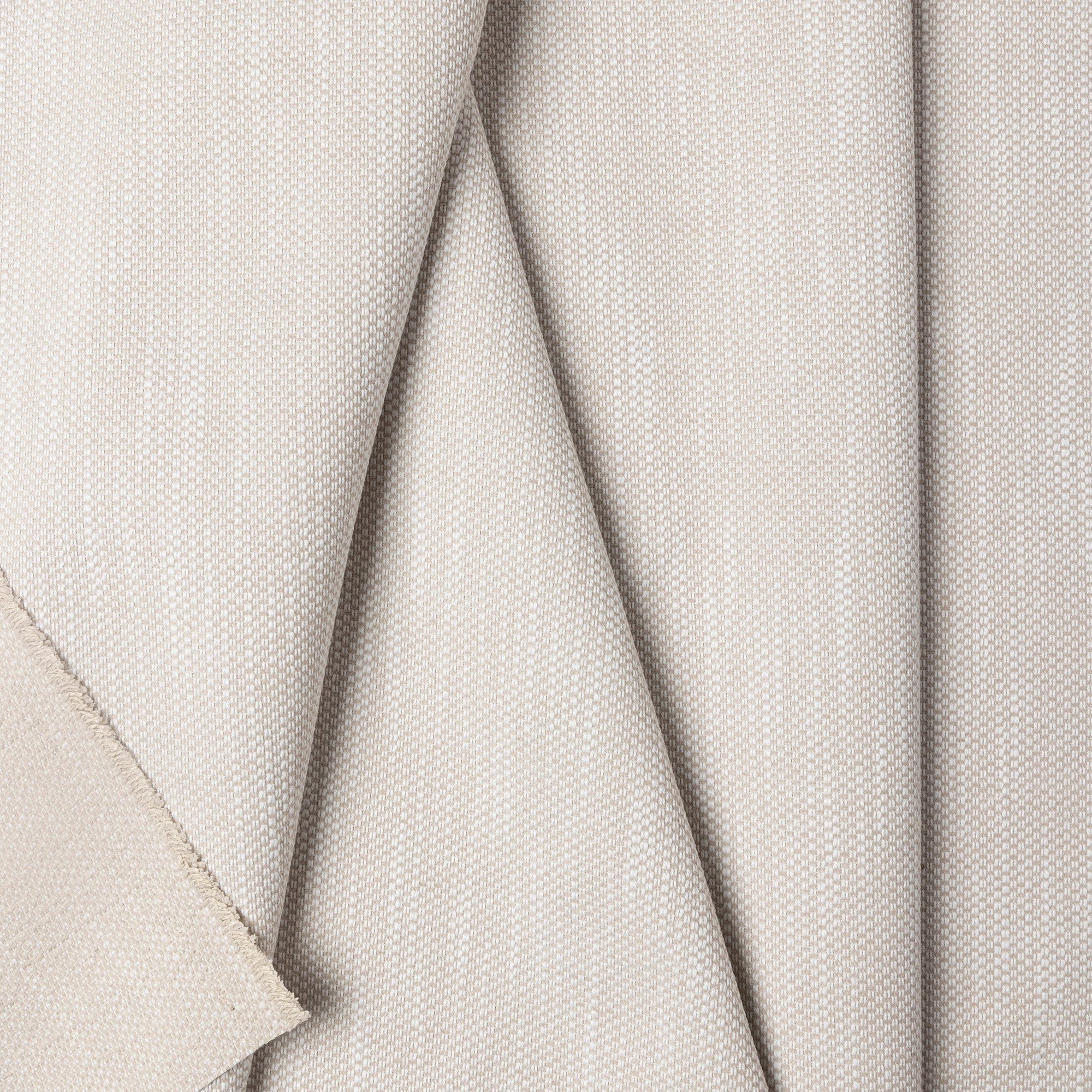 Beige basketweave upholstery fabric by the yard, folded showing drape and weight