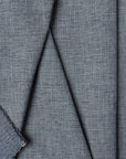 Blue basketweave upholstery fabric by the yard, folded showing drape and weight