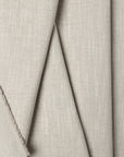 Light gray basketweave upholstery fabric by the yard, folded showing drape and weight