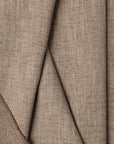 Brown basketweave upholstery fabric by the yard, folded showing drape and weight