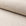 Beige basketweave upholstery fabric by the yard, rolled bolt view