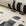 Cream and black brushstroke crosshatch linen fabric by the yard, rolled bolt view