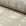 Natural cream brushstroke crosshatch linen fabric by the yard, rolled bolt view