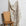Natural cream brushstroke crosshatch linen fabric by the yard, draped to show pattern and scale