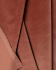 Pink velvet upholstery fabric by the yard, folded showing drape and weight