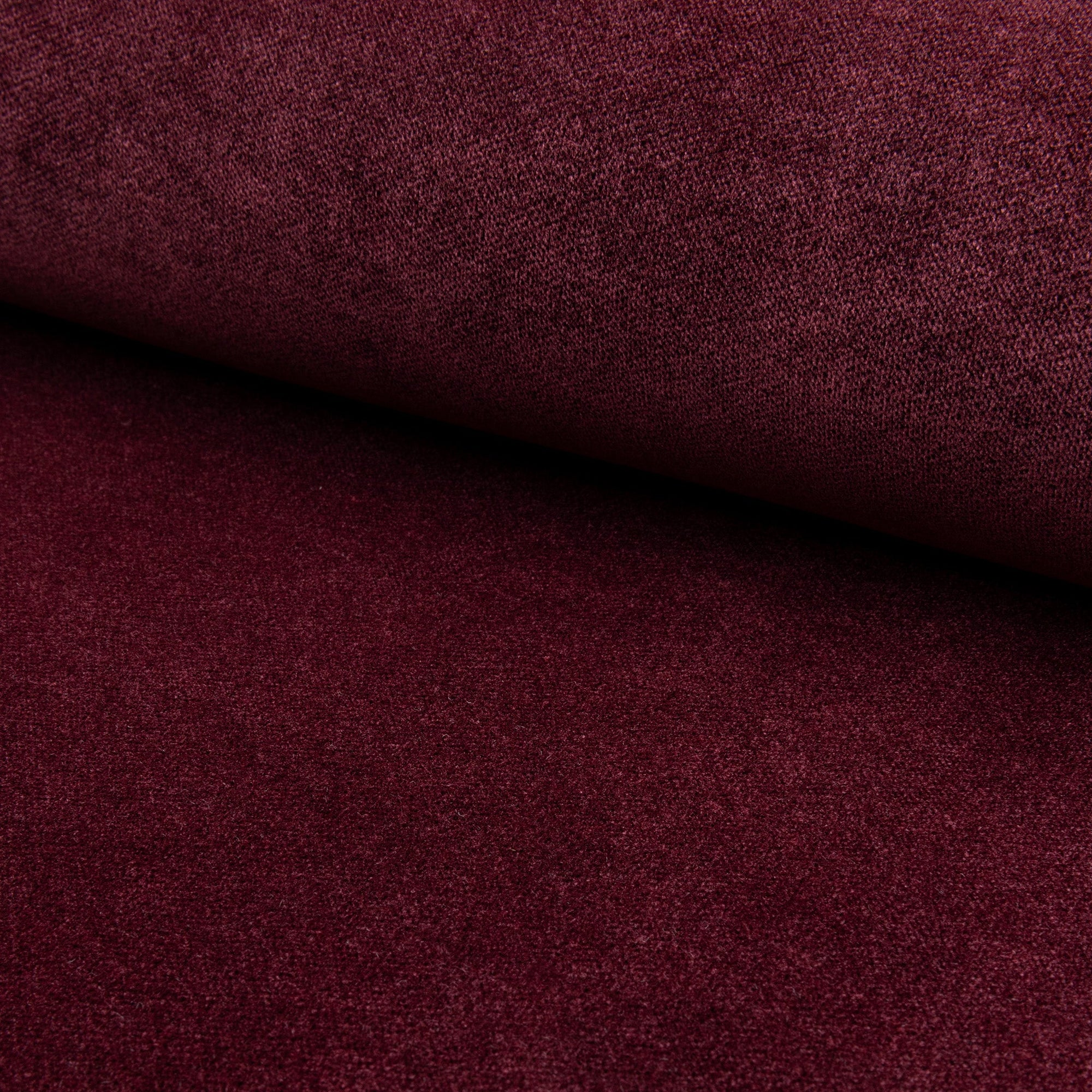 Red velvet upholstery fabric by the yard, rolled bolt view