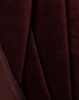 Red velvet upholstery fabric by the yard, folded showing drape and weight