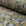 Olive gold and blue botanical leaf printed linen fabric by the yard, rolled bolt view