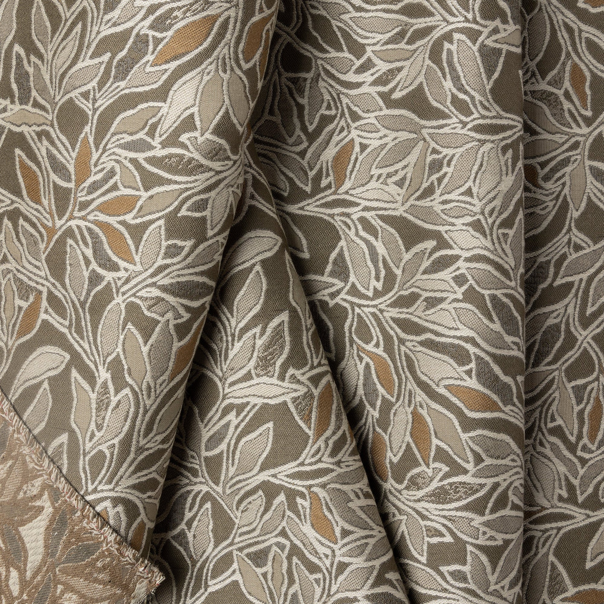 Sand botanical leaf jacquard upholstery fabric by the yard, folded showing drape and weight