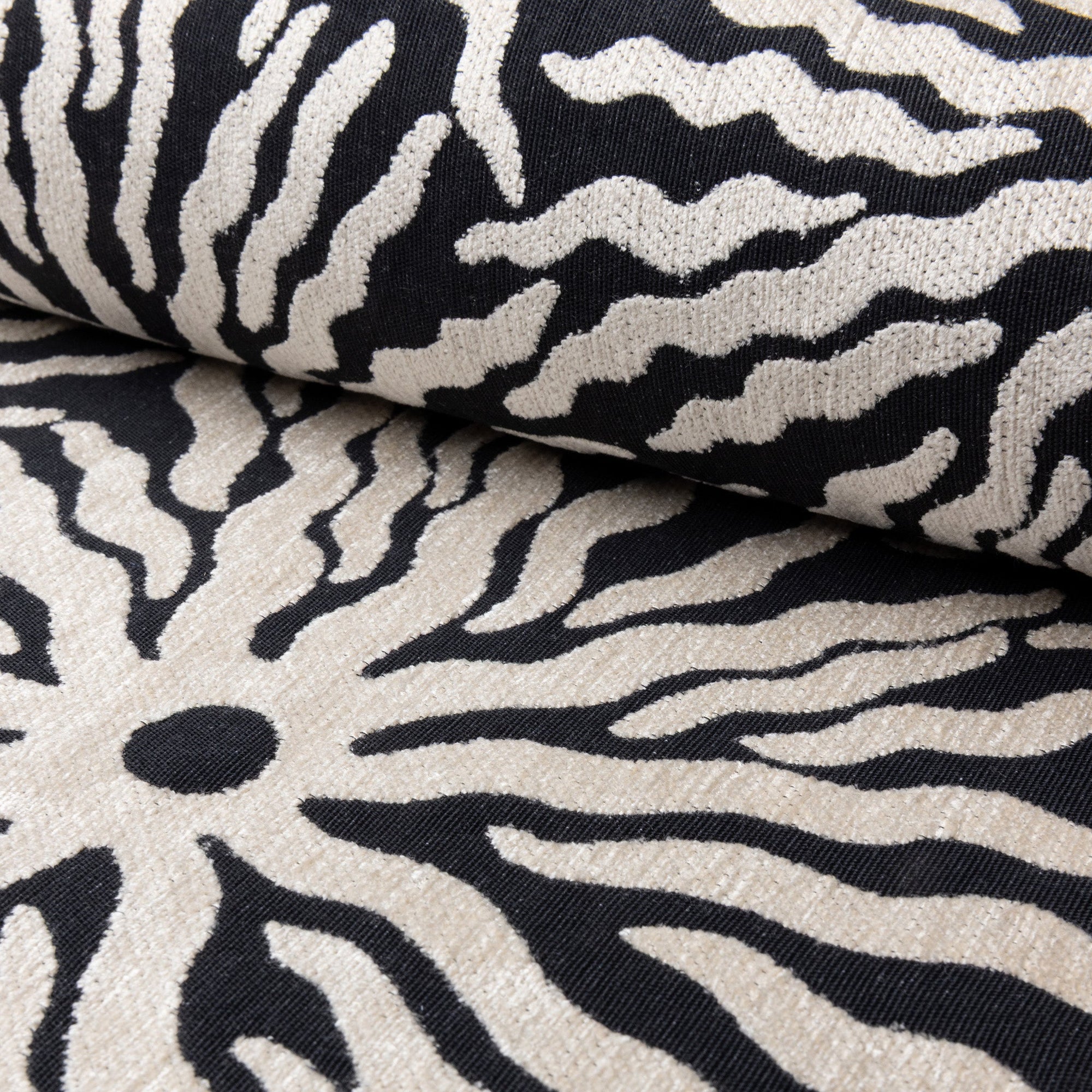Black and ivory sunburst jacquard upholstery fabric by the yard, rolled bolt view