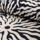 Black and ivory sunburst jacquard upholstery fabric by the yard, rolled bolt view