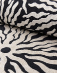 Black and ivory sunburst jacquard upholstery fabric by the yard, rolled bolt view