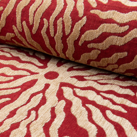 Red and gold sunburst jacquard upholstery fabric by the yard, rolled bolt view