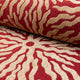 Red and gold sunburst jacquard upholstery fabric by the yard, rolled bolt view