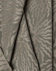 Sage green sunburst jacquard upholstery fabric by the yard, folded showing drape and weight