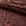 Rust sunburst jacquard upholstery fabric by the yard, rolled bolt view