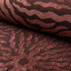 Rust sunburst jacquard upholstery fabric by the yard, rolled bolt view