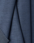 Blue chenille outdoor fabric by the yard, folded showing drape and weight